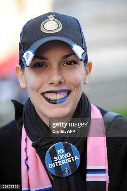 An Inter Milan supporter celebrate at Piazza Duomo in Milan after Inter Milan won the Italia Serie A football title on May 16, 2010. Inter Milan...