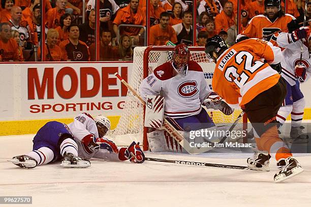 Ville Leino of the Philadelphia Flyers takes a shot on goal against Jaroslav Halak and P.K. Subban of the Montreal Canadiens in Game 1 of the Eastern...