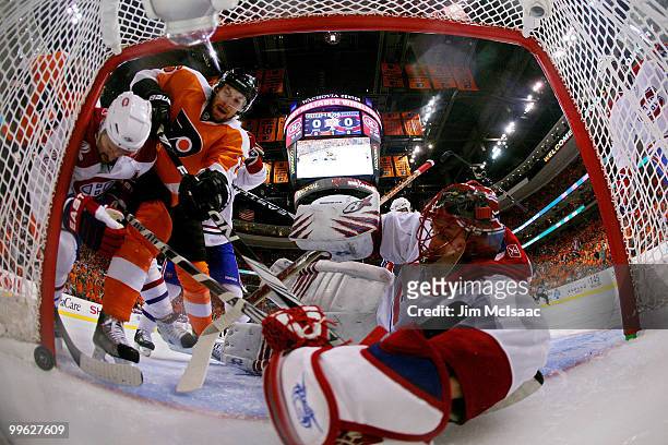 Braydon Coburn of the Philadelphia Flyers scores a goal in the first period against Brian Gionta and Jaroslav Halak of the Montreal Canadiens in Game...