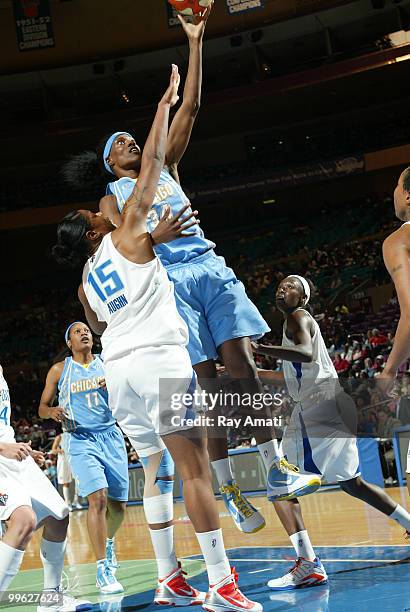 Sylvia Fowles of the Chicago Sky shoots against Kia Vaughn of the New York Liberty during the game on May 16, 2010 at Madison Square Garden in New...