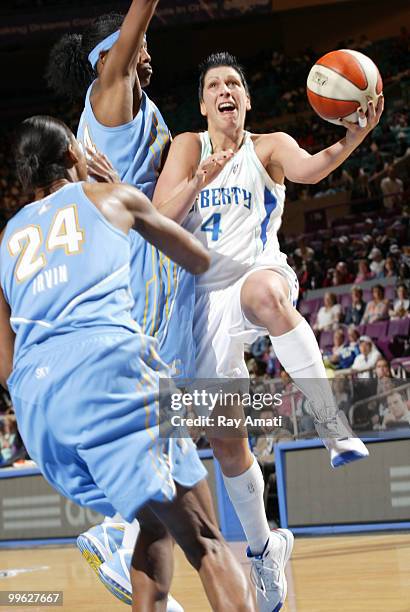 Janel McCarville of the New York Liberty shoots against Sylvia Fowles and Sandora Irvin of the Chicago Sky during the game on May 16, 2010 at Madison...