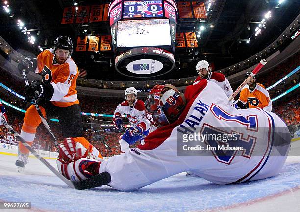 Braydon Coburn of the Philadelphia Flyers on his way to scoring a goal in the first period against goalie Jaroslav Halak of the Montreal Canadiens in...
