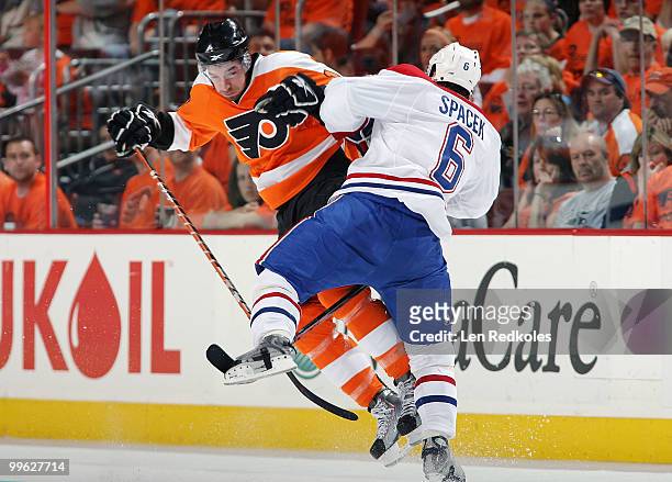 Andreas Nodl of the Philadelphia Flyers collides with Jaroslav Spacek of the Montreal Canadiens in open ice in Game One of the Eastern Conference...