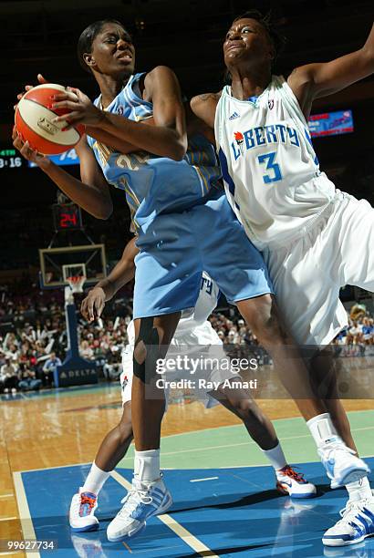 Shameka Christon of the Chicago Sky tries to keep the ball away from Tiffany Jackson of the New York Liberty during the game on May 16, 2010 at...