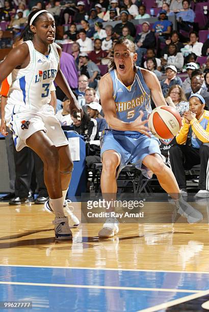 Erin Thorn of the Chicago Sky drives against Tiffany Jackson of the New York Liberty during the game on May 16, 2010 at Madison Square Garden in New...