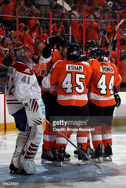 James van Riemsdyk of the Philadelphia Flyers celebrates with his team after scoring a goal in the second period against Jaroslav Halak of the...