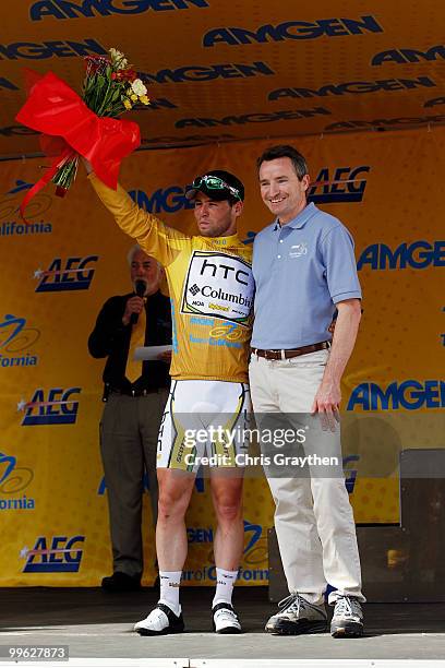 Mark Cavendish of Great Britian riding for team HTC-Columbia celebrates after putting on the leader's yellow jersey for winning stage one of the Tour...