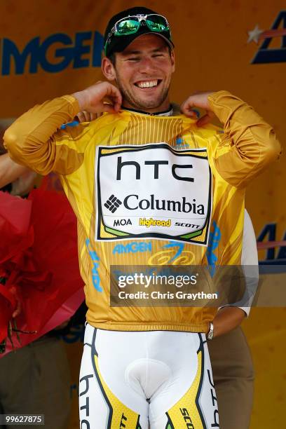 Mark Cavendish of Great Britian riding for team HTC-Columbia smiles as he puts on the yellow leader's jersey after winning stage one of the Tour of...