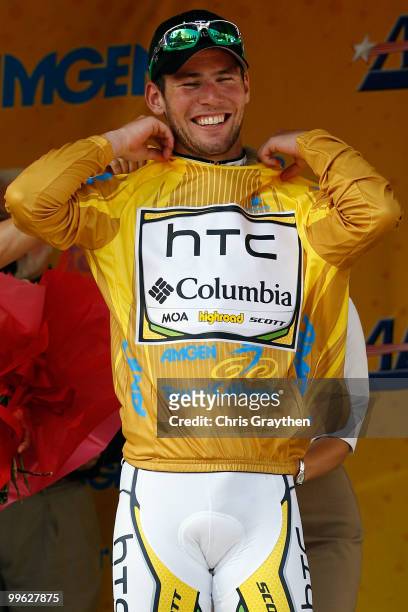 Mark Cavendish of Great Britian riding for team HTC-Columbia smiles as he puts on the yellow leader's jersey after winning stage one of the Tour of...