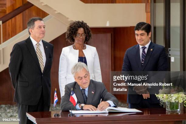 President of Chile Sebatian Pinera signs the guest book of Costa Rica Presidential House joined by Carlos Alvarado President of Costa Rica , Vice...