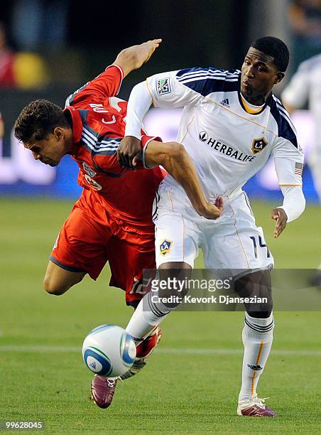 Edson Buddle of Los Angeles Galaxy controls the ball against Adrian Cann of Toronto FC during the first half of the MLS soccer match on May 15, 2010...