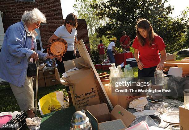 May 15: Louise Gretschel right, a junior on the Blair High School crew team participates in a community yard sale on Saturday, May 15 in order to...