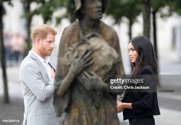 Prince Harry, Duke of Sussex and Meghan, Duchess of Sussex view the Famine Memorial on the bank of the River Liffey during their visit to Ireland on...