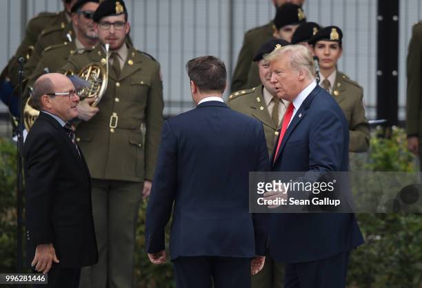 President Donald Trump chats with Luxembourg Prime Minister Xavier Bettel at the opening ceremony at the 2018 NATO Summit at NATO headquarters on...