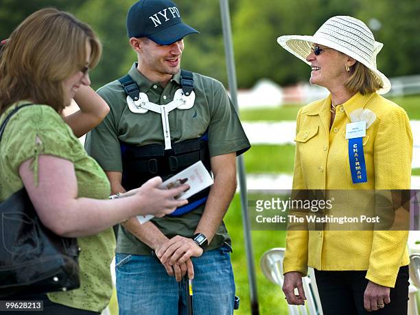 Injured soldier Army Spec. Jeffrie Laferriere, 24 talks to Beverly Bosselmann at the annual Potomac Hunt Club races in Poolesville, MD on May 16,...