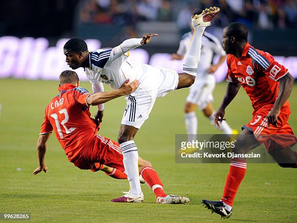 Edson Buddle of Los Angeles Galaxy in action against Adrian Cann of Toronto FC during the first half of the MLS soccer match on May 15, 2010 at the...