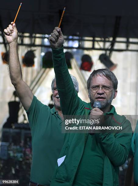 Colombian presidential candidate for the Green Party, Antanas Mockus, holds a pencil as he delivers a speech during a rally in Bogota on May 16,...