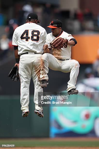 Pablo Sandoval and Andres Torres of the San Francisco Giants celebrate after the game against the Houston Astros at AT&T Park on May 16, 2010 in San...
