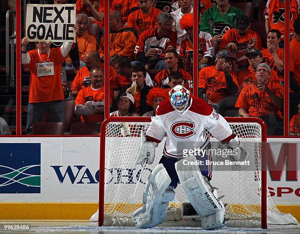 Fan of the Philadelphia Flyers holds up a sign reading "Next Goalie" behind goalie Carey Price of the Montreal Canadiens in Game 1 of the Eastern...