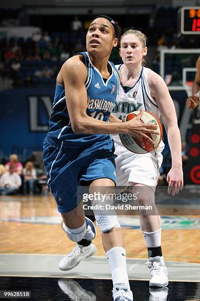 Lindsey Harding of the Washington Mystics drives to the basket past Lindsay Whalen of Minnesota Lynx during the 2010 Lynx season home opening game on...