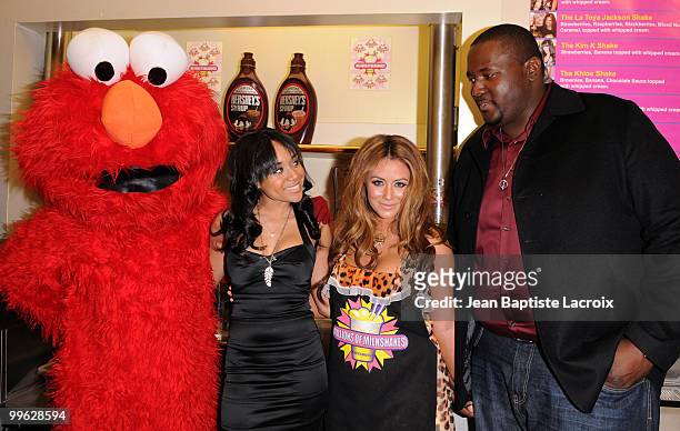Aubrey O'Day and Quinton Aaron visits Millions of Milkshakes on March 13, 2010 in West Hollywood, California.