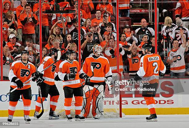 Kimmo Timonen, Ryan Parent, Danny Briere, Michael Leighton, and Lukas Krajicek of the Philadelphia Flyers celebrate after defeating the Montreal...