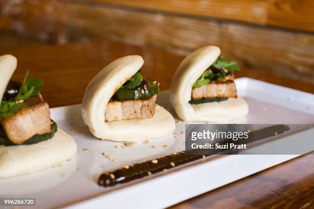 lucky belly pork belly buns - suzi pratt stock pictures, royalty-free photos & images