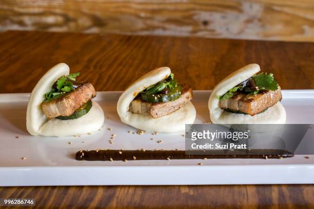 lucky belly pork belly buns - suzi pratt stock pictures, royalty-free photos & images