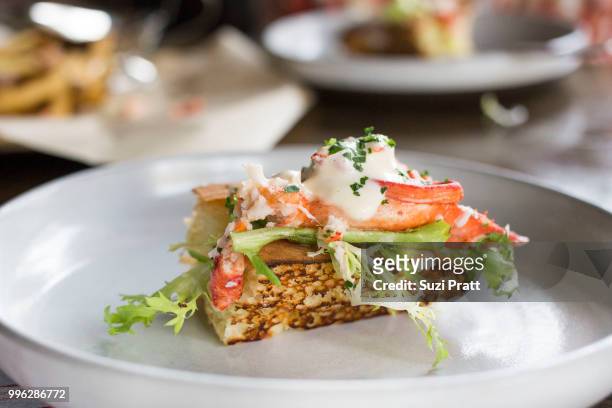 lobster roll at livestock tavern in hawa - suzi pratt stock pictures, royalty-free photos & images