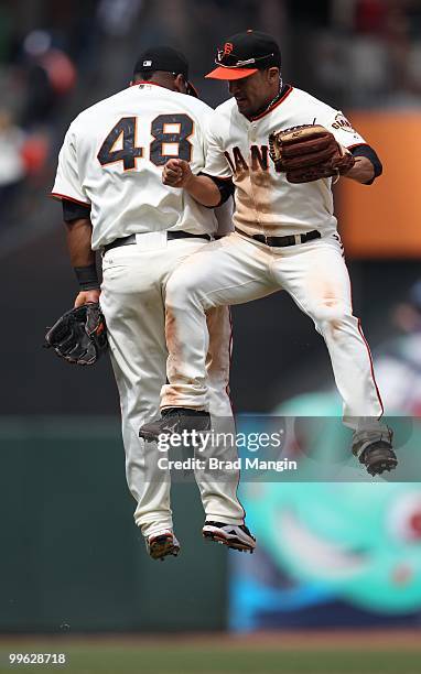 Pablo Sandoval and Andres Torres of the San Francisco Giants celebrate after the game against the Houston Astros at AT&T Park on May 16, 2010 in San...