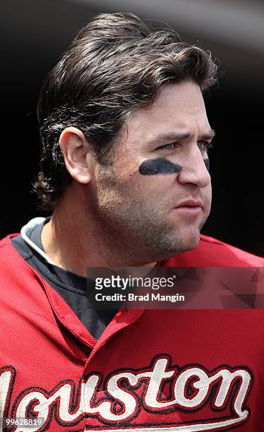 Lance Berkman of the Houston Astros waits in the dugout for his next at bat during the game against the San Francisco Giants at AT&T Park on May 16,...