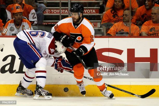 Subban of the Montreal Canadiens fights for the puck against Ville Leino of the Philadelphia Flyers in Game 1 of the Eastern Conference Finals during...