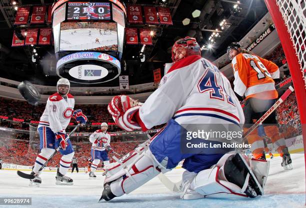 Scott Hartnell of the Philadelphia Flyers, PK Subban, and goaltender Jaroslav Halak of the Montreal Canadiens watch a shot by Flyer Danny Briere...