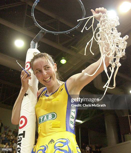 Liz Ellis of the Swifts celebrates by cutting the net down after victory in the Commonwealth Bank Trophy Netball Grand final between the Sydney...