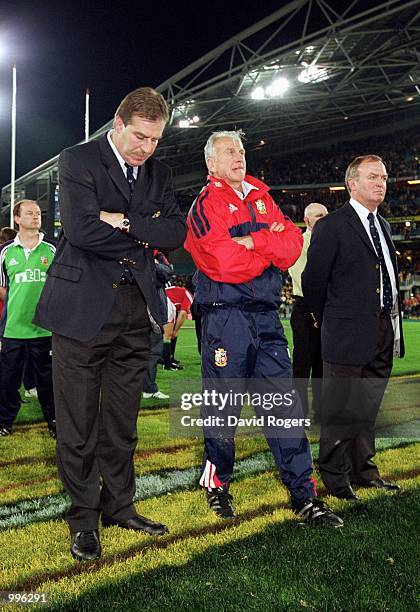 Manager Donal Lenihan , Defensive coach Phil Larder and coach Graham Henry of the British and Irish Lions are dejected after the third and final Test...