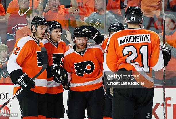 Lukas Krajicek, Matt Carle, Claude Giroux, and James van Riemsdyk of the Philadelphia Flyers celebrate Giroux's goal in the third period against the...