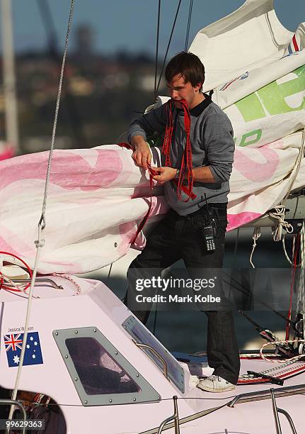 Mike Perham works on deck as teen sailor Jessica Watson arrives back home in Sydney following her world record attempt to become the youngest person...