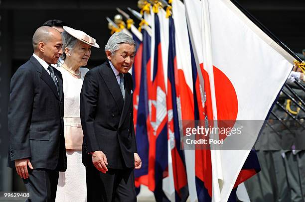 King Norodom Sihamoni of Cambodia follows Emperor Akihito and Empress Michiko of Japan on their way to a welcoming ceremony at the Imperial Palace on...