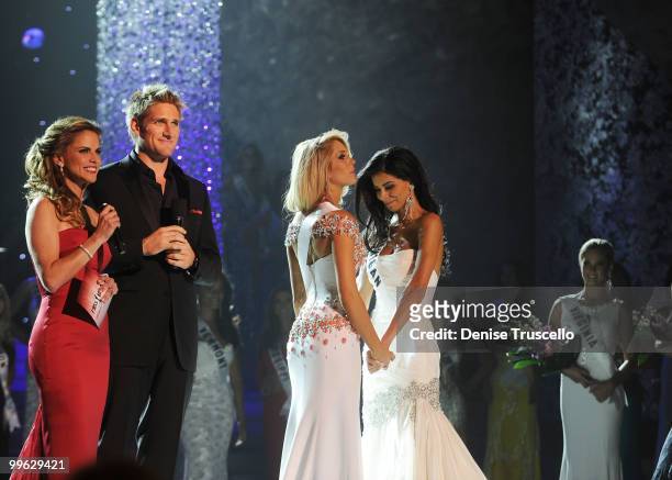 Miss Oklahoma Morgan Elizabeth Woolard and Miss Michigan Rima Fakih wait for the final result at the Miss USA 2010 pageant at Planet Hollywood Casino...