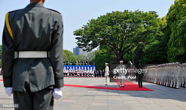 King Norodom Sihamoni of Cambodia reviews a guard of honor during a welcoming ceremony at the Imperial Palace on May 17, 2010 in Tokyo, Japan....