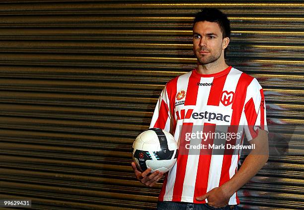 Michael Beauchamp poses for photographers after he is announced as Melbourne Heart Football Club's latest signing ahead of the Qantas Socceroos match...