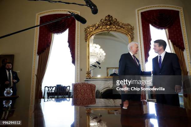 Senate Finance Committee Chairman Orrin Hatch welcomes Judge Brett Kavanaugh to the Senate President pro tempore office before a meeting at the U.S....