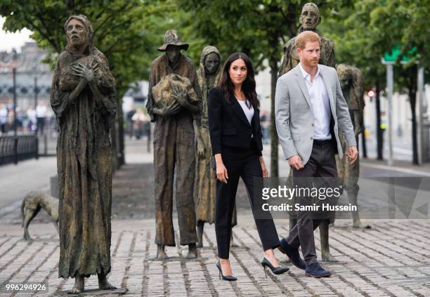 Prince Harry, Duke of Sussex and Meghan, Duchess of Sussex visit the Famine Memorial during their visit to Ireland on July 11, 2018 in Dublin,...