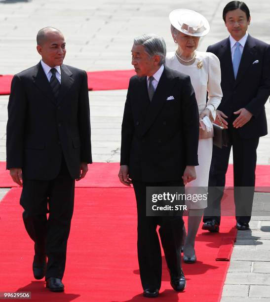 Norodom Sihamoni of Cambodia is escorted by Japanese Emperor Akihito , Empress Michiko and Crown Prince Naruhito during a welcoming ceremony at the...
