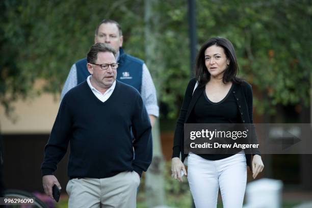 Bobby Kotick, chief executive officer of Activision Blizzard, and Sheryl Sandberg, chief operating officer of Facebook, arrive for a morning session...