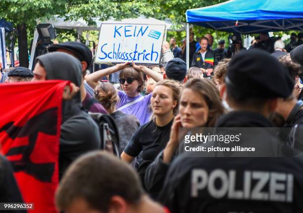July 2018, Munich, Germany: Leftist groups protest outside the Higher Regional Court. Here, after more than five years and more than 430 trial days,...