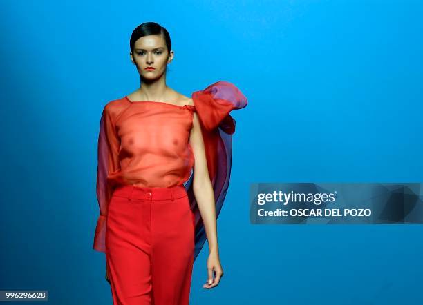 Model displays an outfit of Spanish designer Menchen Tomas Spring/Summer 2019 collection during the Madrid's Mercedes Benz Fashion Week on July 11,...