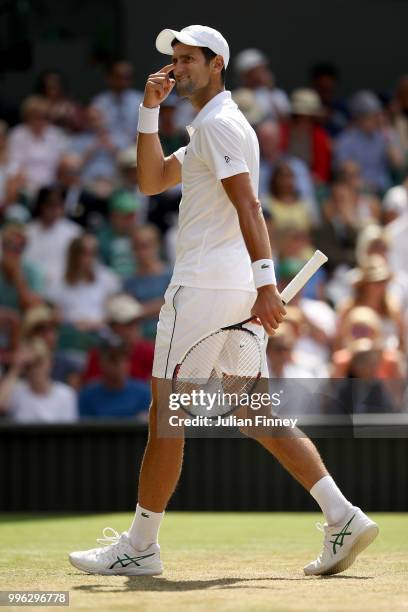 Novak Djokovic of Serbia reacts against Kei Nishikori of Japan during their Men's Singles Quarter-Finals match on day nine of the Wimbledon Lawn...
