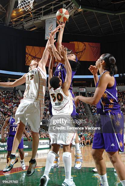 Candace Parker of the Los Angeles Sparks goes to the basket against Tanisha Wright and Lauren Jackson of the Seattle Storm on May 16, 2010 at Key...