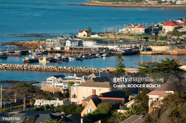 View of Kalk Bay, a trendy fishing village, about 30km from the city centre, taken on July 11 in Cape Town. - Kalk Bay, with a combination of trendy...